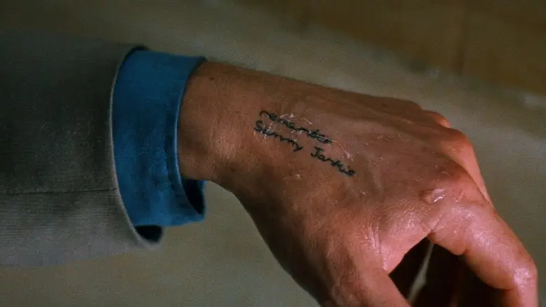 Writing tattooed on Leonard's wrist in Memento