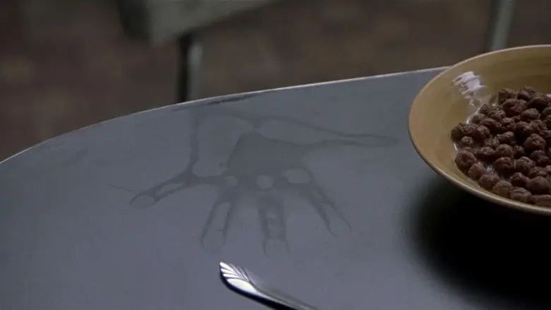 A hand-shaped mark on a tabletop in The Sixth Sense