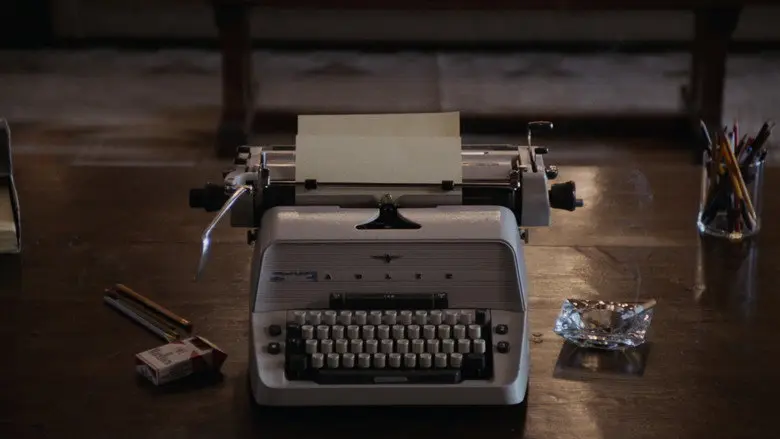 A typewriter on a dark desk in The Shining