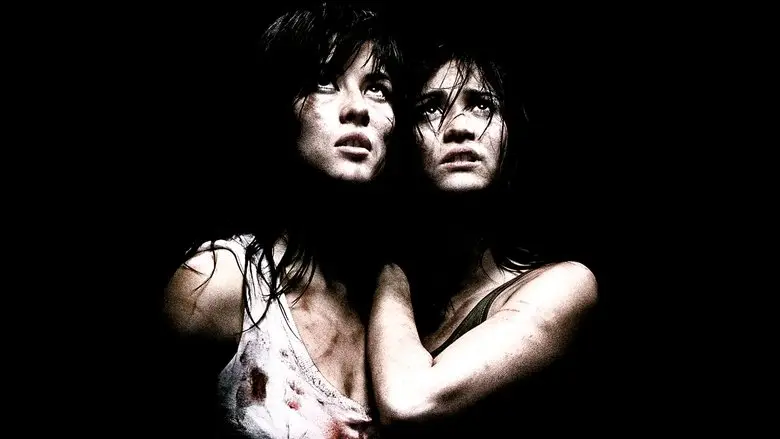 Two distressed women against a black background in Martyrs