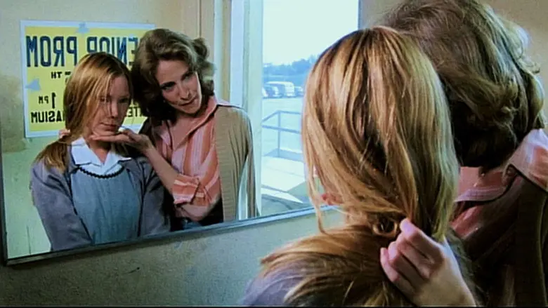 Two girls reflected in a mirror in Carrie