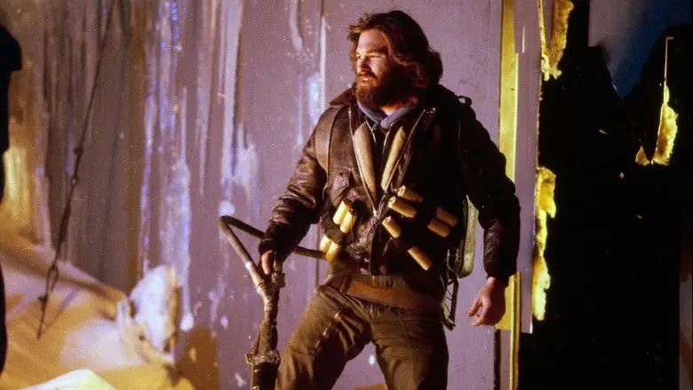 MacReady standing in an icy doorway in The Thing