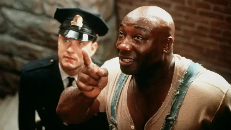 Paul Edgecomb and John Coffey stand together in The Green Mile