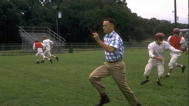 Forrest runs across a football field in Forrest Gump