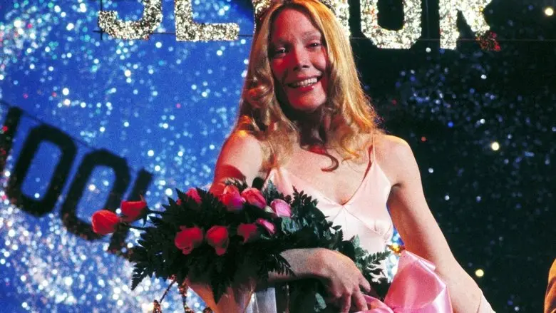 Carrie holding flowers beneath the prom lights
